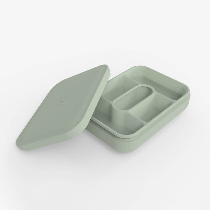 ezpz travel box in sage green is an all-in-one feeding + storage system that helps families pack, transport, and serve baby’s meals when away from home #color_sage